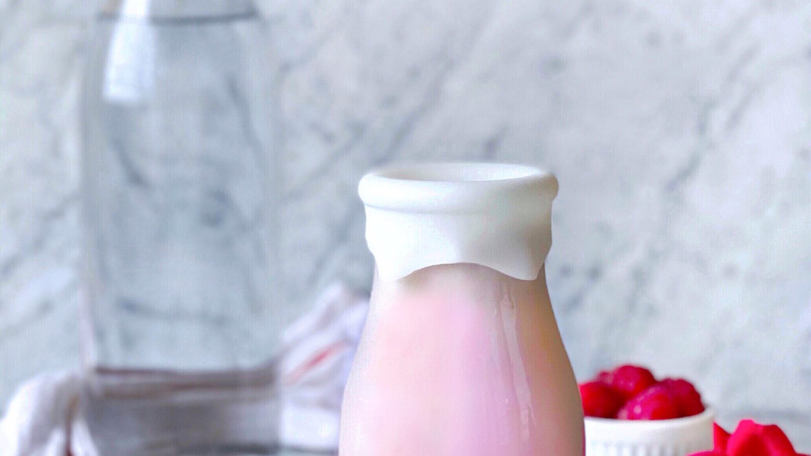 Premium Photo  Photo of Almond Rose Milk Almond Flavored Milk Base Infused  Wiphoto of Rose Front View Clean BG